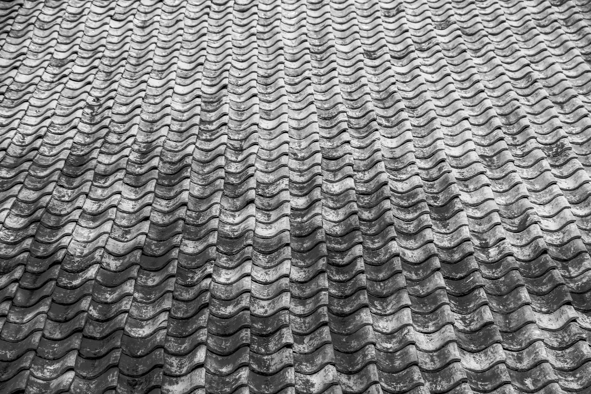 Silver-gray roof surface with a wavy texture