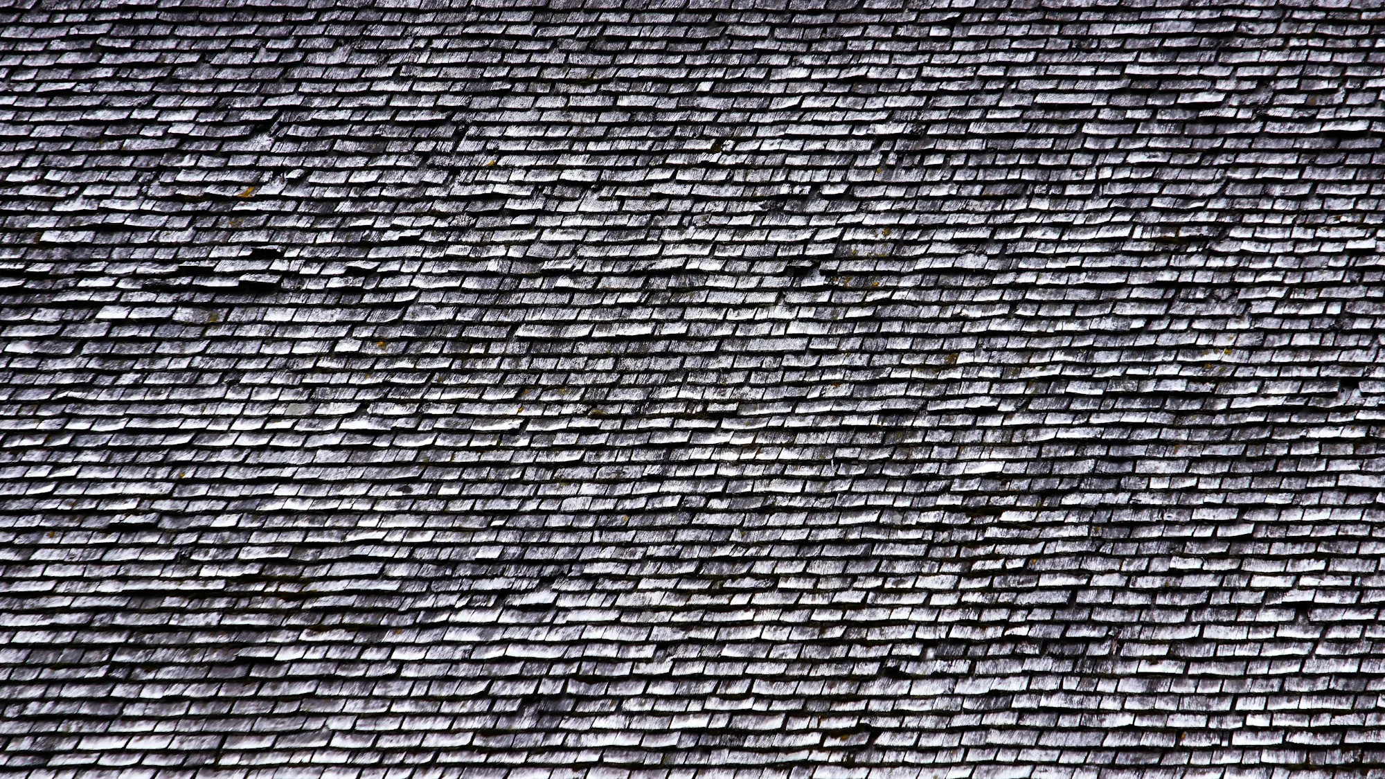 Full-frame texture of dark gray roof shingles